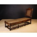 A Fine Walnut and Seaweed Marquetry Day Bed with caned back & support protected by a long black