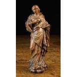 A Fine 17th Century Flemish Boxwood Carving of Madonna dressed in flowing robes with a demon