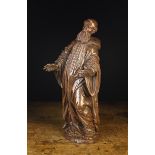 A 16th Century Walnut Carving of a Monk.