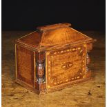 A 19th Century Welsh Inlaid Wooden Money Box. The bevelled walnut top centred by a large coin slot.