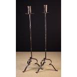 A Pair of Tall Floor Standing Wrought Iron Candle Stands.