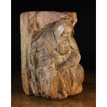 A 15th Century French Provincial Wooden Corbel/Bracket carved in the form of Hermit and dog,