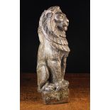 An Antique Oak Newel Post Finial carved in the form of a Lion Sejant,