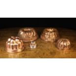 A Group of Five Decorative Copper Moulds: Two Bundt Tins and three jelly moulds including one by