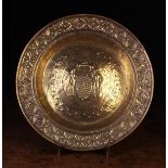An Early 18th Century Repoussé Alms Dish.
