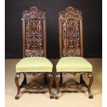 A Pair of Daniel Marot Inspired Carved Walnut Side Chairs.