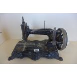 A Gustav Winselmann hand crank sewing machine, 43cm long, some wear but appears to work