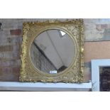 An ornate gilt mirror