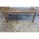 A rustic pine kitchen table, 188cm long, 85cm wide