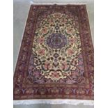 A hand knotted woollen Fine Kashan rug, approx 185cm x 120cm - in good condition