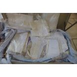 A trunk full of assorted vintage linen and lace work including trim and table cloths