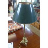 A brass table lamp with tri-form base, 82cm tall with shade