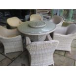 A Bramblecrest Chester table, 150cm diameter, six chairs and a lazy Susan, ex-display