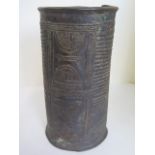 A Nigerian Benin Bronze wrist cuff of tapering cylindrical form, flange rims, decorated with ribbing