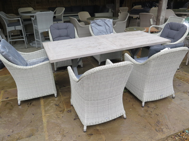 A Bramblecrest Monterey rectangular table, 155cm x 90cm, with six chairs, ex-display