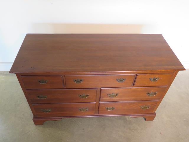 A 20th Century reproduction seven drawer chest, 133cm wide x 82cm H - Image 2 of 2