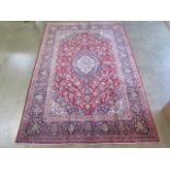 A hand knotted woollen Persian rug, 220cm x 197cm