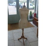 A Stockman dress makers dummy, on an adjustable tripod base, some staining and wear but a good