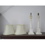 A pair of white marble table lamps, 52cm tall, and a pair of shades, shades need fittings