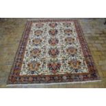 A hand knotted woollen Heriz rug - 190cm x 156cm