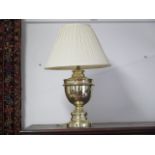 A lacquered brass table lamp with shade, 64cm tall