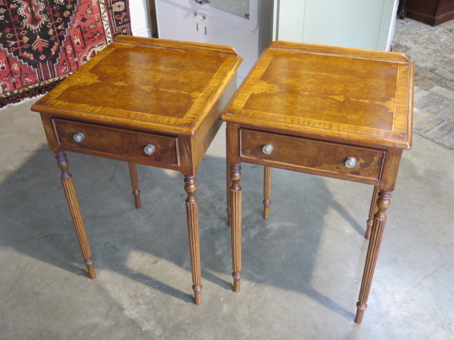 A pair of burr oak lamp tables with a single drawer on turned reeded legs, 76cm H x 50cm x 49cm -