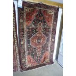 A hand knotted woollen Hamadan rug 222x135cm