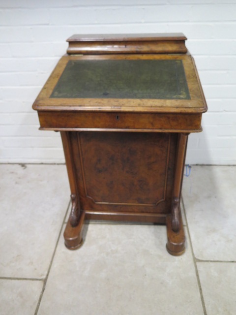 A Victorian burr walnut davenport desk with a stationary compartment, fitted interior and four