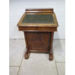 A Victorian burr walnut davenport desk with a stationary compartment, fitted interior and four