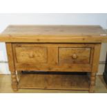 A stripped pine kitchen butchers block with two drawers and an under tier incorporating old timbers
