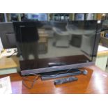 A Sony 32 inch flat screen TV, in working order, with remote control