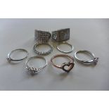 Eight silver dress rings