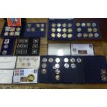 A collection of commemorative plated coins and a 2017 2oz silver coin and a £5 silver coin