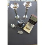 A pair of weighted silver vases, 14cm tall, a silver and tortoiseshell pot, a silver clip, a