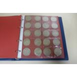 A British silver coin collection, many coins uncirculated - in an eight page folder