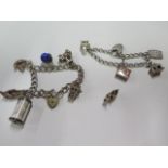 Two silver charm bracelets with various charms and a loose charm, approx 2.1 troy oz