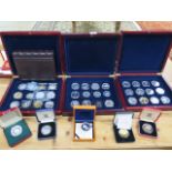 A collection of forty silver and other coins in three coin collectors cases, total weight approx