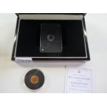 A boxed 1/10 oz platinum 1988 Canadian 30 Dollar coin and a 9ct 1 gram coin