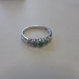 An 18ct white gold, emerald and diamond ring, size N, approx 2.2 grams - in generally good condition