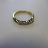 An 18ct yellow gold, seven stone diamond ring, size Q, approx 3.1 grams - in generally good