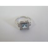 An 18ct hallmarked white gold aquamarine and diamond ring, head size 10x11mm, ring size Q, approx