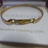 A hot Diamonds hallmarked 9ct gold bangle, approx 7.2 grams, boxed generally good, 6x5cm