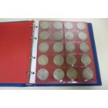 A British silver coin collection, many coins uncirculated - in an eight page folder