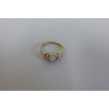 A hallmarked 9ct opal three stone ring, size M, good condition