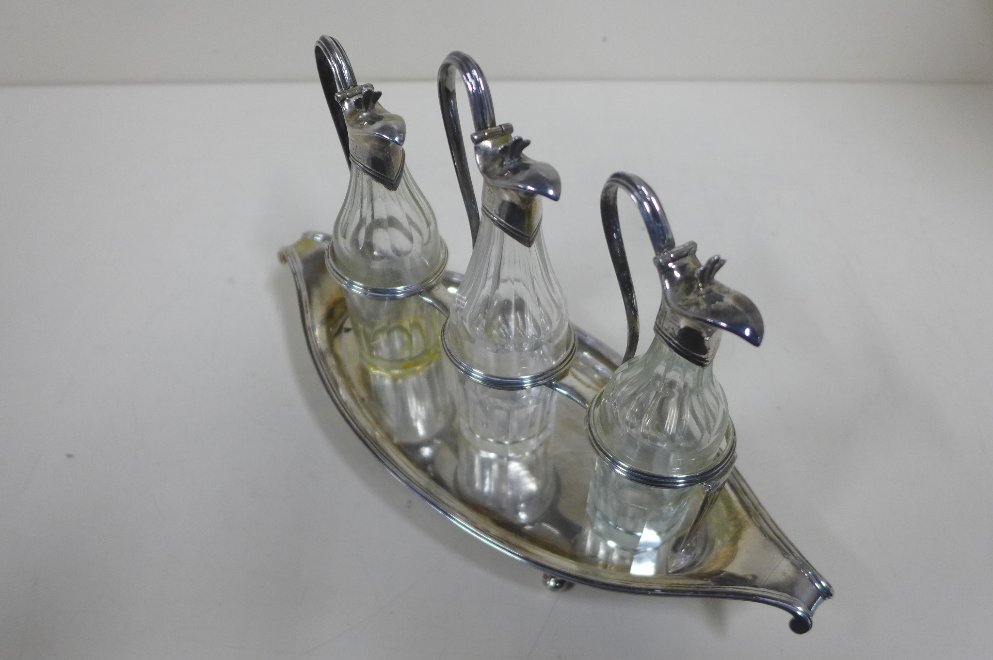 A good Georgian Navette shaped three bottle condiment set, London 1789/90 - John Scofield, weighable