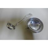 A silver strainer and silver sifter spoon, approx 1.9 troy oz, generally good