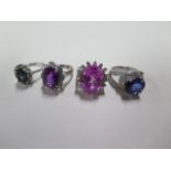 Four coloured stone set dress rings