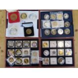 A collection of assorted silver plated and gold plated collectors coins