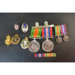 World War II medal group 1939-1945 medals and Defence medal with miniatures ans associated badges,