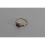 An antique gold garnet cluster ring, size N/O, approx 2 grams, in good condition, not hallmarked